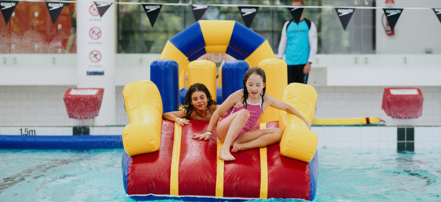 Kids Going down inflatable slide