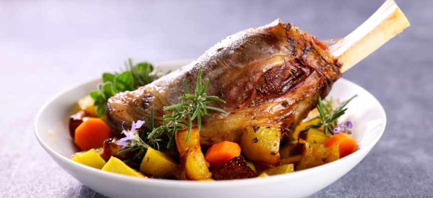 Plate of cooked lamb and veggies