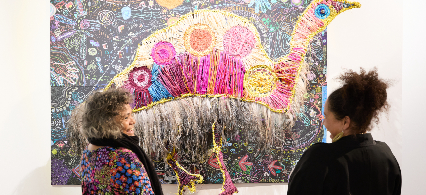 Weavers Caroline Glass-Paterson and Karleen Green in front of the 2024 Weaving Stories Emu Dreaming artwork