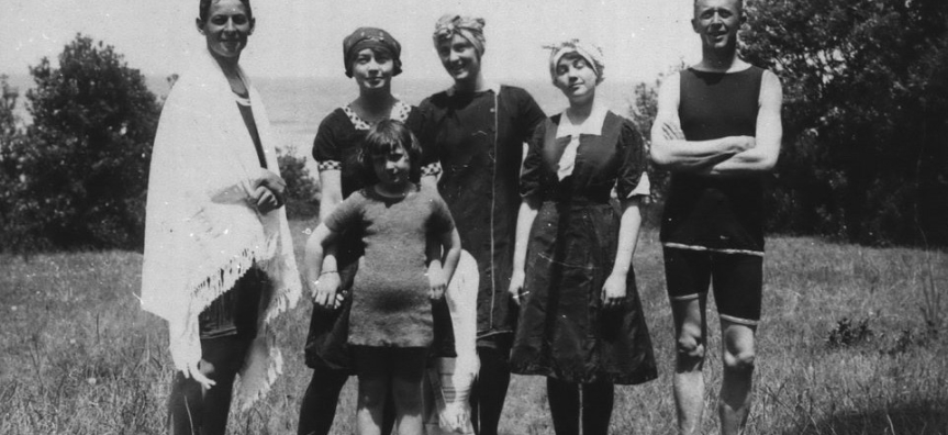 Family standing on a beach