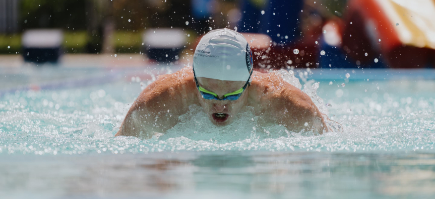 Swimmer with head out of water wearing goggles