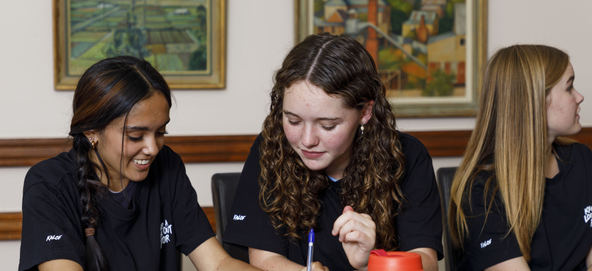 Two women writing