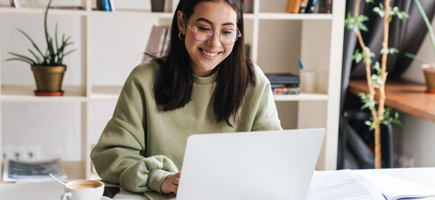 Happy young woman studying