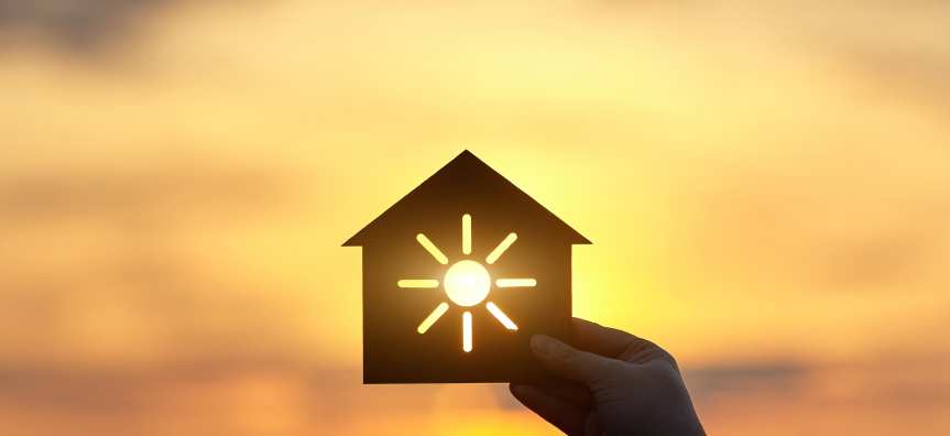 An image of a house with the sun shining through