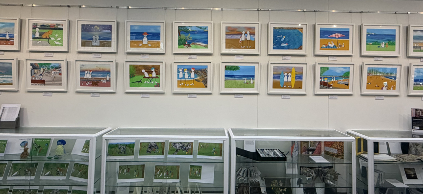 Views on a bench framed exhibition artworks installed manly library