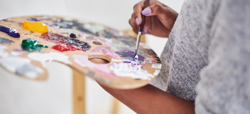 mixing paints on palette