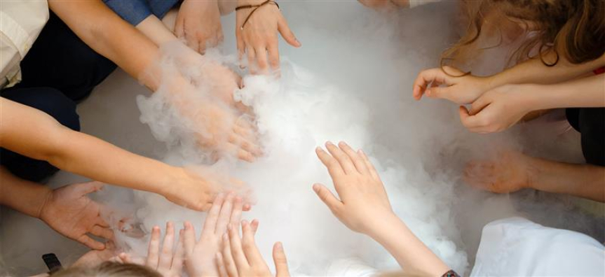 Kids gathered around dry ice
