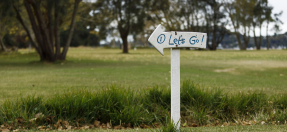 Lets go sign on golf course