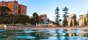 view of surf club and beach from water