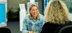 A member of the public speaking with a customer service officer