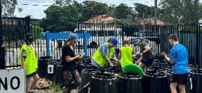 Group of children helping compost