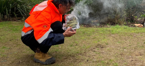 Darran Williams performing smoking ceremony at Little Manly Beach Reserve