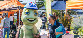 Tilly the Turtle with children at open day