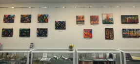 Abstract paintings by ArtAbility on exhibition wall