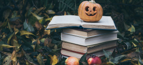 Halloween pumpkin and books