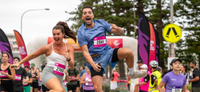 Excited runners finishing Sun Run 2024