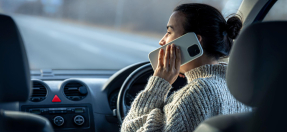 Woman talking on phone while driving