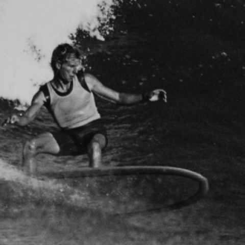 black and white photo of Midgett Farrelly surfing