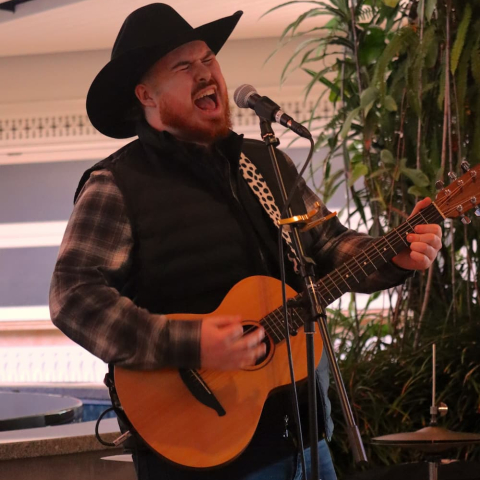 Fynn Meaney playing on stage