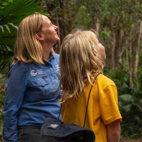 school child and CEC educator looking at environment